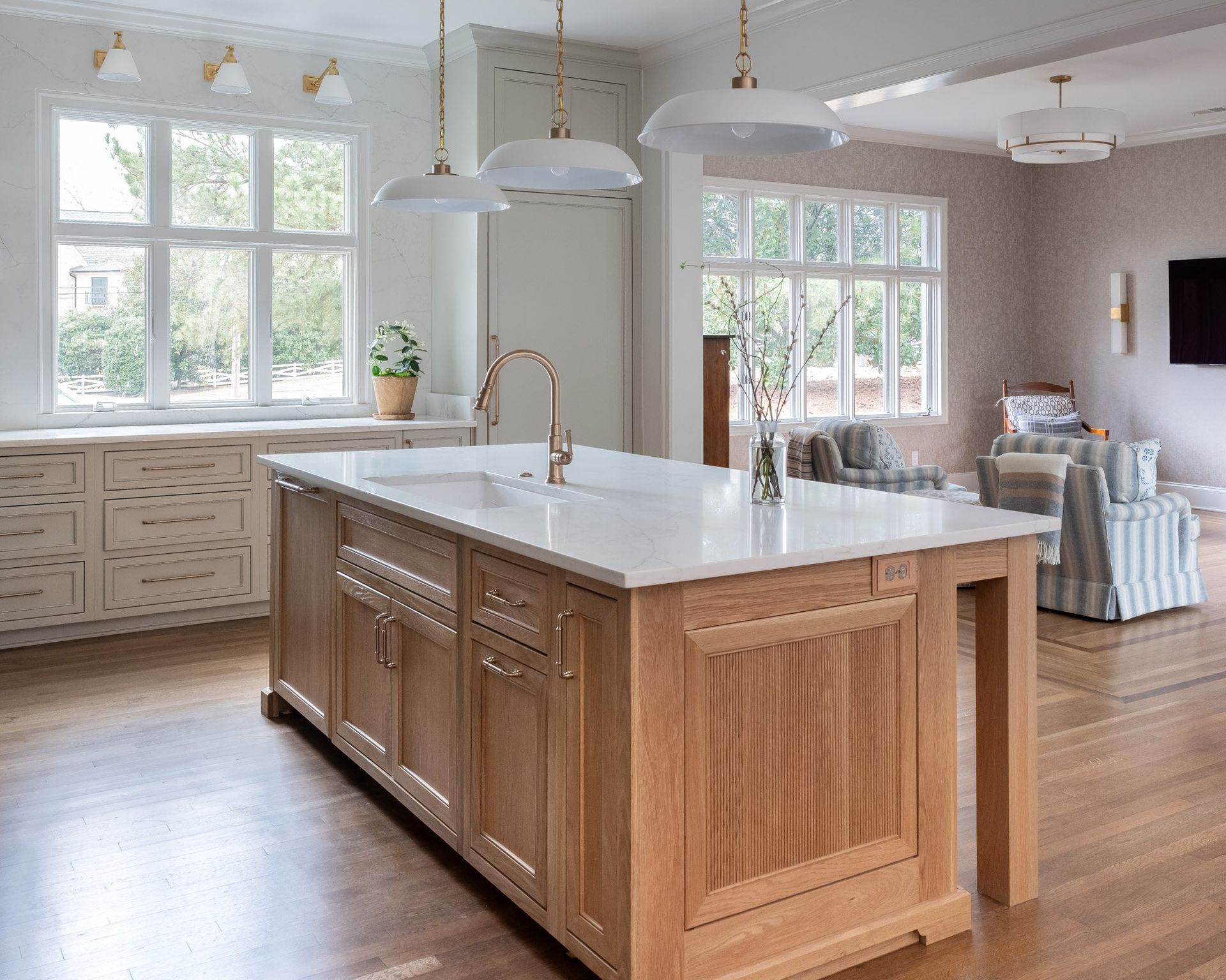 Gray painted kitchen with white oak island by Designer Cabinets