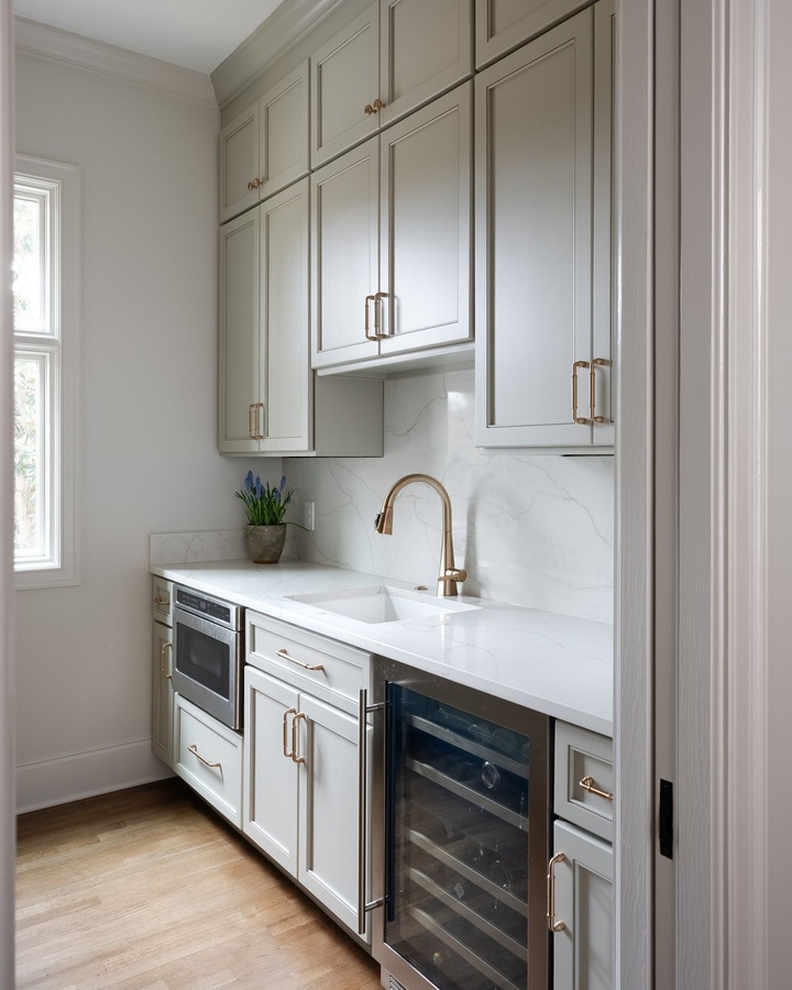 Gray shaker pantry cabinetry by Designer Cabinets