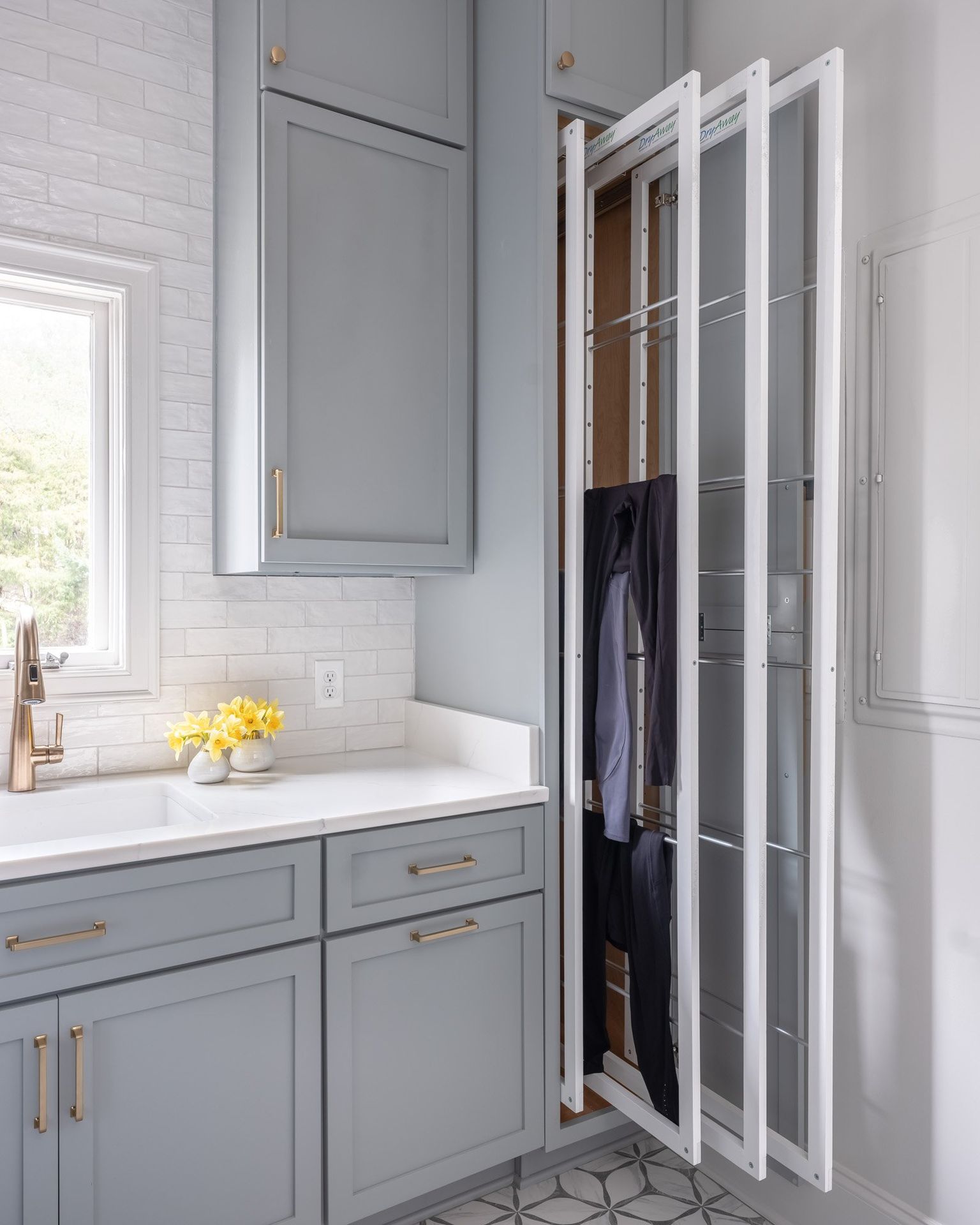 Gray painted kitchen with white oak island by Designer Cabinets