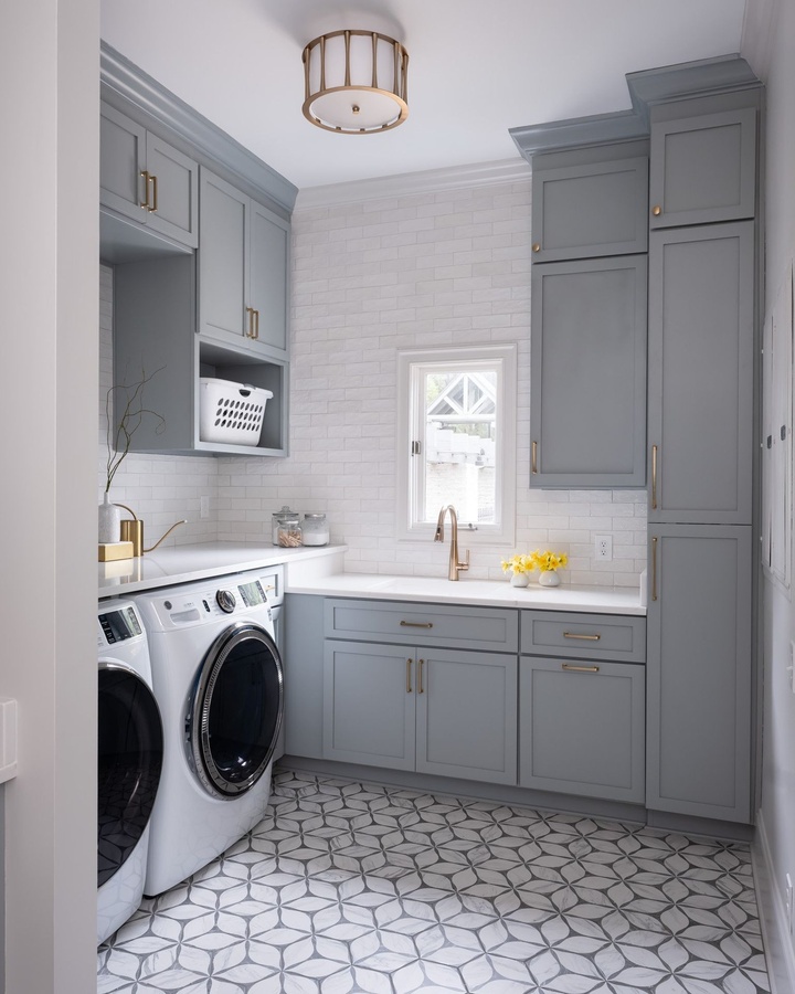 Blue shaker laundry cabinetry by Designer Cabinets