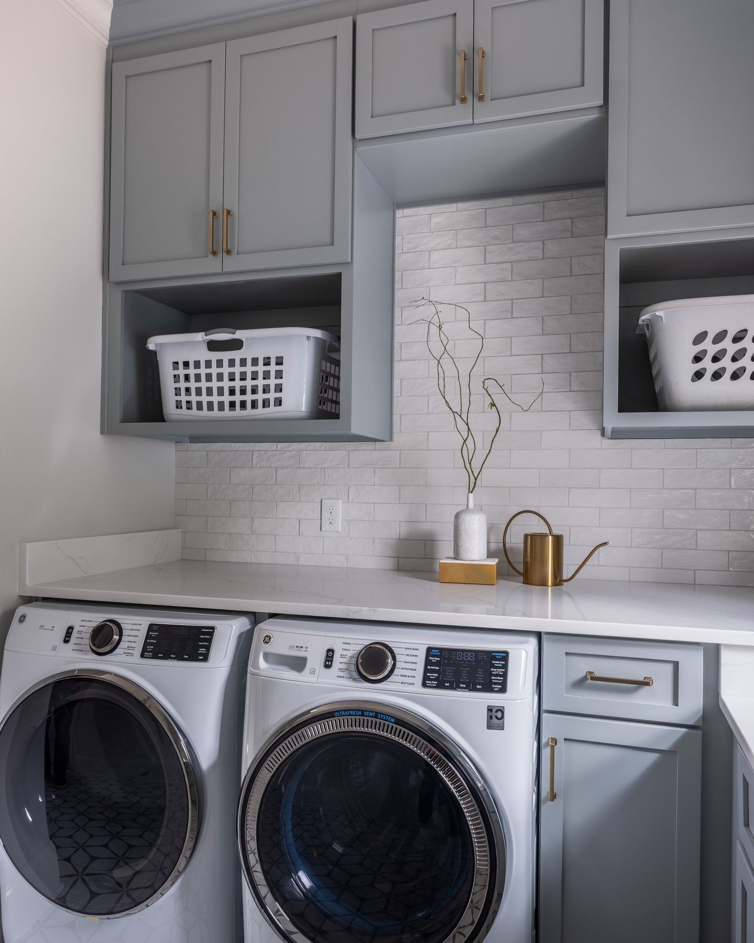 Gray painted kitchen with white oak island by Designer Cabinets