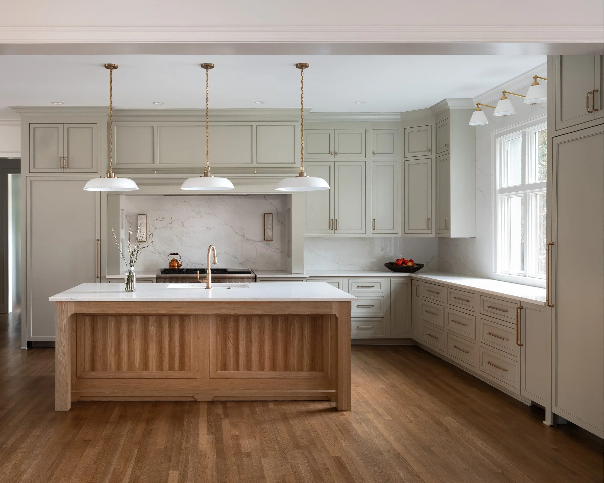 Gray painted kitchen with white oak island by Designer Cabinets