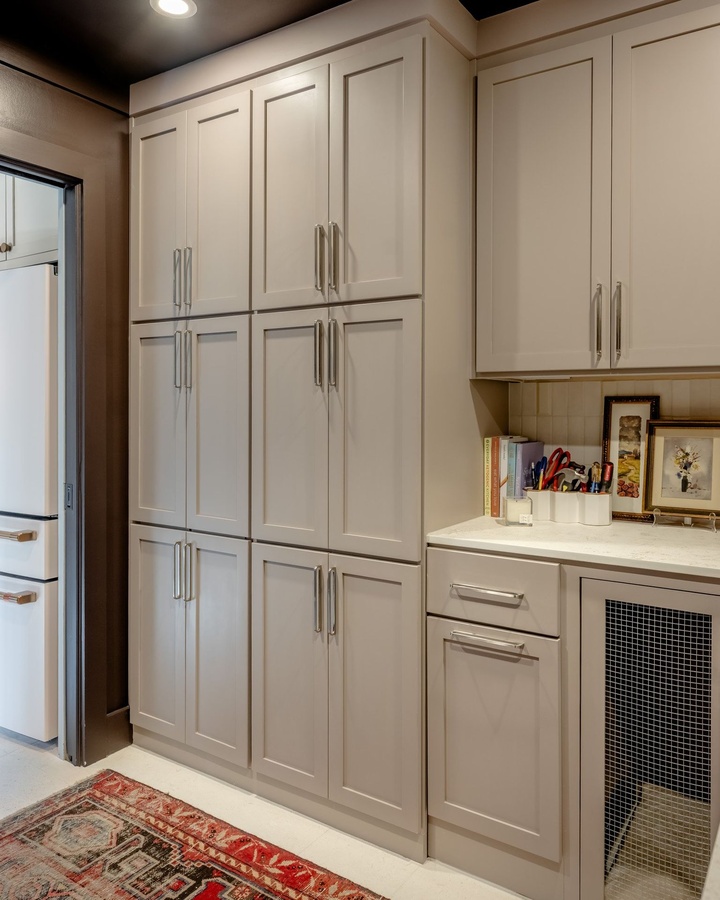 Greige shaker pantry cabinetry by Designer Cabinets