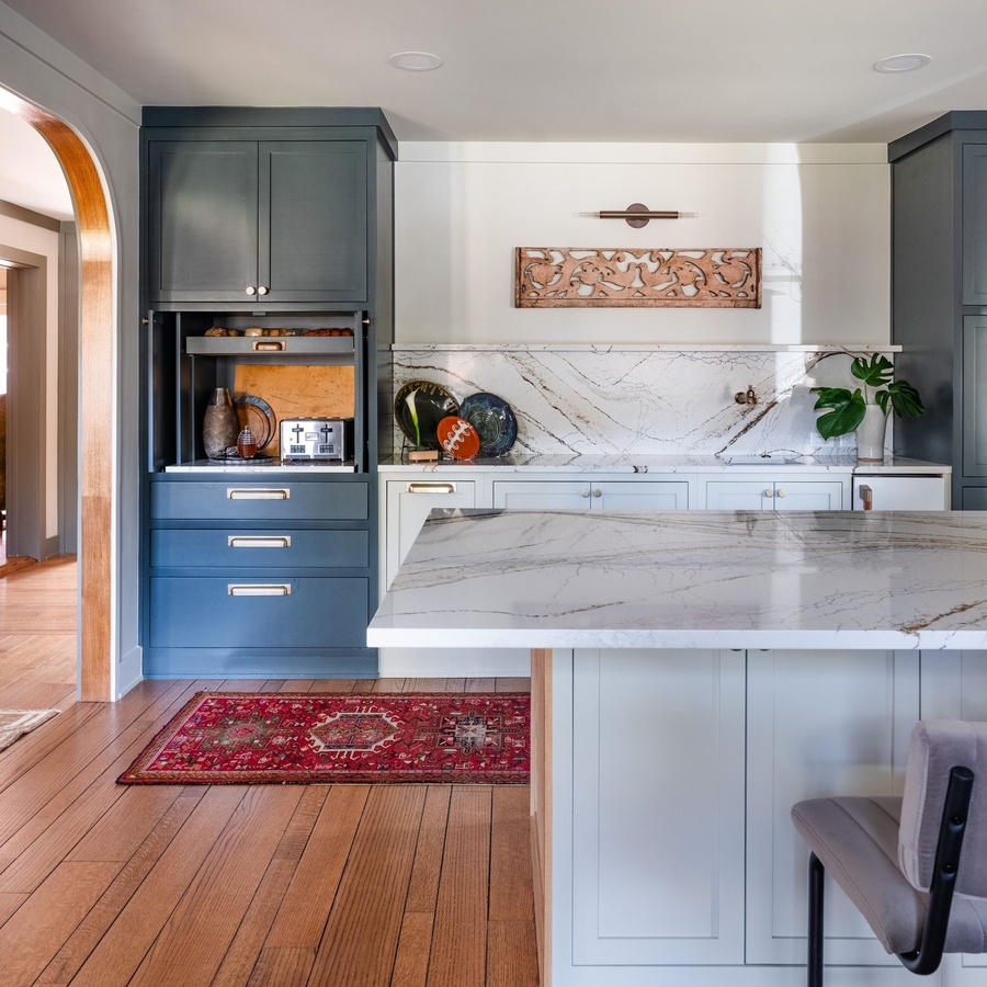 Greige shaker kitchen cabinetry by Designer Cabinets