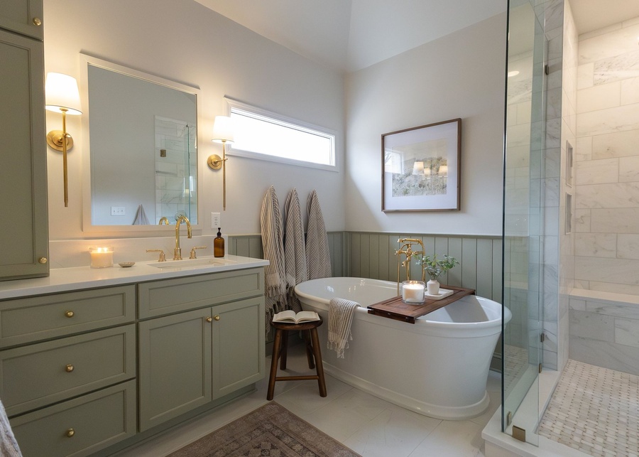 Green shaker bath cabinetry by Designer Cabinets