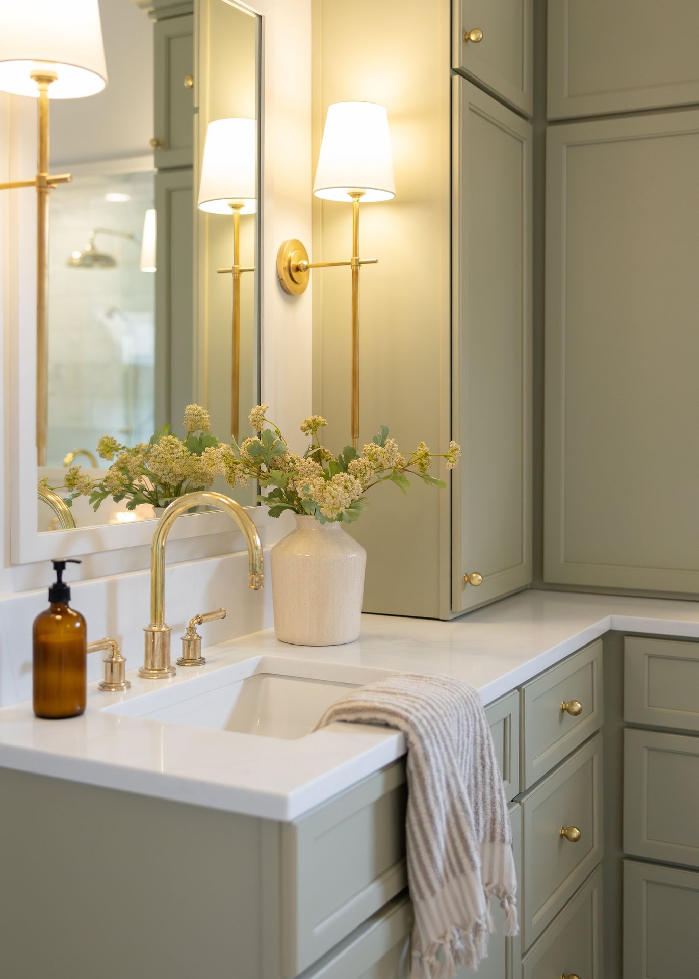 Green bathroom vanity by Designer Cabinets