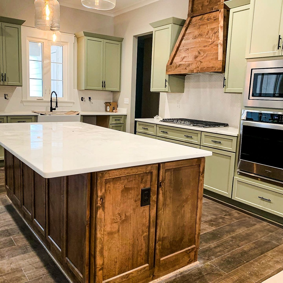 Green and wood shaker kitchen cabinetry by Designer Cabinets